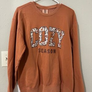 “Cozy Season” Printed On Comfort Colors Warm Orange Sweatshirt